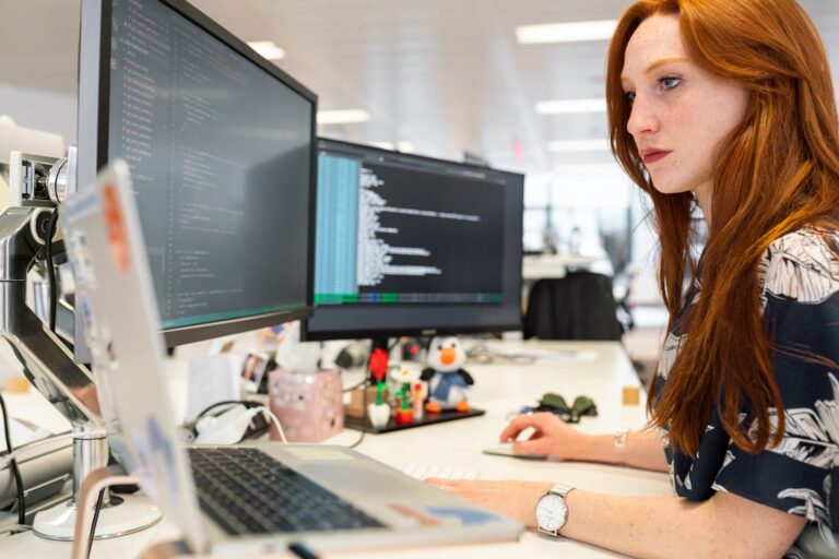 Cybersecurity analyst working at computer detecting threats — GLADiiUM MDR service