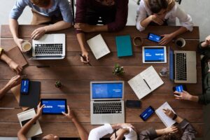 Team collaborating on digital learning platform — LMS365 and GLADiiUM Technology Partners